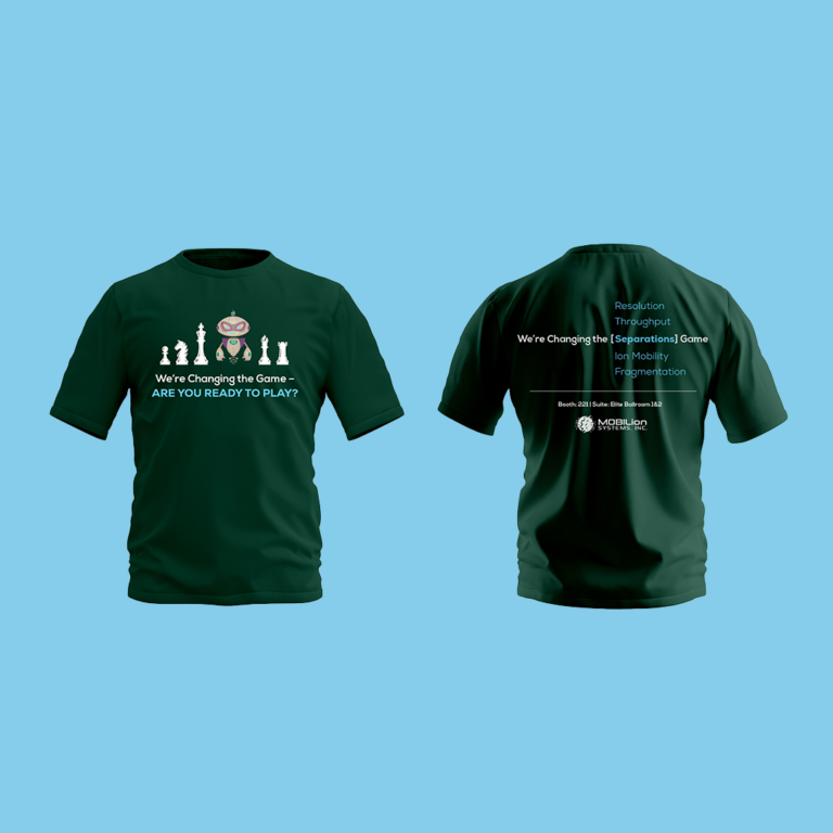 Dark green t-shirt featuring a robot surrounded by white chess pieces. Below the images, text reads: “We’re Changing the Game – ARE YOU READY TO PLAY?” The background is light blue.