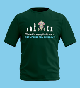 Dark green t-shirt featuring a robot surrounded by white chess pieces. Below the images, text reads: “We’re Changing the Game – ARE YOU READY TO PLAY?” The background is light blue.